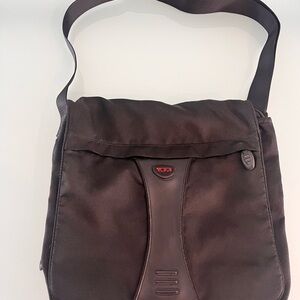 Tumi Black Messenger Bag with Red Logo Accent